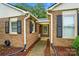 Up-close view of a well-maintained brick house exterior with black shutters at 656 Ne Camrose Ne Cir, Concord, NC 28025