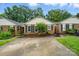 Charming brick home with manicured landscaping and a concrete driveway at 656 Ne Camrose Ne Cir, Concord, NC 28025