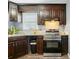 This kitchen showcases stainless steel appliances, granite counters, and plenty of cabinet space at 656 Ne Camrose Ne Cir, Concord, NC 28025
