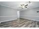 Open concept living room with vinyl floors and neutral paint at 656 Ne Camrose Ne Cir, Concord, NC 28025