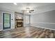 Cozy living room with stone fireplace, ceiling fan and plenty of natural light at 656 Ne Camrose Ne Cir, Concord, NC 28025