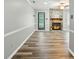 Spacious living room with fireplace and vinyl floors at 656 Ne Camrose Ne Cir, Concord, NC 28025