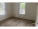 Bright bedroom with two windows offering ample natural light and modern flooring at 659 Annafrel St, Rock Hill, SC 29730