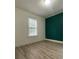Bright bedroom featuring neutral walls, a window and sleek, modern flooring at 659 Annafrel St, Rock Hill, SC 29730