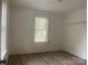 Bright bedroom featuring neutral walls, a window and sleek, modern flooring at 659 Annafrel St, Rock Hill, SC 29730