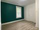 Bright bedroom featuring neutral walls, a window and sleek, modern flooring at 659 Annafrel St, Rock Hill, SC 29730