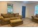 Bright living room featuring neutral walls, new flooring, and ample natural light from large windows at 659 Annafrel St, Rock Hill, SC 29730