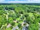 Neighborhood aerial view with tree-lined streets and well-maintained homes at 6705 Reddman Rd, Charlotte, NC 28212