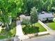 Aerial view of property showcasing a well-manicured lawn and mature trees at 6705 Reddman Rd, Charlotte, NC 28212