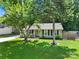 Beautiful single-story home with a well-kept lawn, a small porch, and lovely landscaping at 6705 Reddman Rd, Charlotte, NC 28212