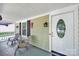 Welcoming front porch with seating area and decorative front door at 6705 Reddman Rd, Charlotte, NC 28212