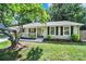 Charming home with a inviting front porch and well manicured yard at 6705 Reddman Rd, Charlotte, NC 28212
