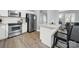 Bright kitchen with stainless steel appliances, granite countertops, and wood-look flooring at 6705 Reddman Rd, Charlotte, NC 28212
