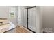 Bathroom showcasing double vanity with granite countertops and a glass shower at 7129 Jerimoth Dr, Charlotte, NC 28215