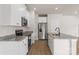 Stylish kitchen showcasing granite countertops, stainless steel appliances, and white cabinetry at 7129 Jerimoth Dr, Charlotte, NC 28215