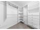 Walk-in closet with custom shelving, drawers, and ample storage for organizing your wardrobe at 715 N Church St # 513, Charlotte, NC 28202