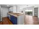 Modern kitchen featuring sleek blue cabinetry, stainless steel appliances, and bar seating at 715 N Church St # 513, Charlotte, NC 28202