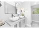 Elegant bathroom featuring a double vanity with vessel sinks, arched mirrors, and soft lighting for a spa-like experience at 715 White Oaks Cir, Monroe, NC 28110