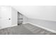 Attic bedroom with a closet, carpet and bright white trim at 715 White Oaks Cir, Monroe, NC 28110