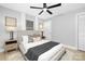 Serene bedroom with a comfortable bed, soft lighting, and neutral decor, creating a relaxing retreat at 715 White Oaks Cir, Monroe, NC 28110