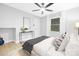 Bright bedroom with a comfortable bed, a stylish console table and modern decor at 715 White Oaks Cir, Monroe, NC 28110