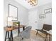 Stylized home office with a modern desk, comfortable seating, and a clean, organized workspace at 715 White Oaks Cir, Monroe, NC 28110