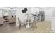 Cozy breakfast nook adjacent to kitchen features seating for three and neutral tones at 715 White Oaks Cir, Monroe, NC 28110