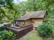 Spacious rear deck offering outdoor living space with mature landscaping and wooded surroundings at 715 White Oaks Cir, Monroe, NC 28110