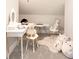 Bright room with a charming vanity, plush rug, and a variety of stuffed animals for a cozy and playful atmosphere at 715 White Oaks Cir, Monroe, NC 28110