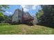 Backyard featuring a deck with stairs and a partial view of the house at 7425 Hubbard Woods Rd, Charlotte, NC 28269
