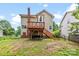 Backyard featuring a deck with stairs and a partial view of the house at 7425 Hubbard Woods Rd, Charlotte, NC 28269
