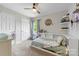 Bright bedroom with a ceiling fan and a built-in headboard with shelving at 7425 Hubbard Woods Rd, Charlotte, NC 28269