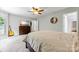Bedroom with neutral carpet, ceiling fan, and views of the outdoors at 7425 Hubbard Woods Rd, Charlotte, NC 28269