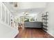 Bright living room with hardwood floors, open layout, and a staircase at 7425 Hubbard Woods Rd, Charlotte, NC 28269
