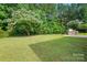 Backyard with green grass and trees at 78114 Rillstone Dr, Lancaster, SC 29720