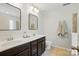 Elegant bathroom with double vanity, matching mirrors, and great lighting at 78114 Rillstone Dr, Lancaster, SC 29720