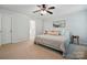 Bright bedroom with carpet, ceiling fan, neutral colors and access to an ensuite bathroom at 78114 Rillstone Dr, Lancaster, SC 29720