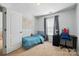 Well-lit bedroom with a desk, chair, and comfortable bed with a world map at 78114 Rillstone Dr, Lancaster, SC 29720