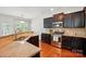 Kitchen featuring a stainless steel stove, granite countertops and dark wood cabinets at 78114 Rillstone Dr, Lancaster, SC 29720