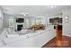 Open-concept living space with hardwood floors, a fireplace, and seamless connection to dining and kitchen at 78114 Rillstone Dr, Lancaster, SC 29720