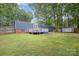Backyard view of deck and landscaping behind home at 870 Family Dr, Midland, NC 28107