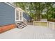 Exterior view of the backyard deck with stairs to the yard at 870 Family Dr, Midland, NC 28107