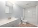 Bathroom with gray vanity and combined shower and tub at 870 Family Dr, Midland, NC 28107