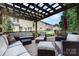 Spacious back deck with shaded seating, creating an inviting outdoor lounge area at 10237 Broken Stone Ct, Charlotte, NC 28214