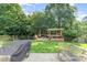 Expansive backyard with lush green grass and an inviting deck, perfect for outdoor activities at 10237 Broken Stone Ct, Charlotte, NC 28214