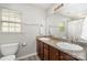 Bathroom featuring double sinks, granite counters, and shower/tub combo with tile surround at 10237 Broken Stone Ct, Charlotte, NC 28214