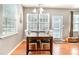 Cozy dining room with hardwood flooring, chandelier and lots of natural light at 10237 Broken Stone Ct, Charlotte, NC 28214