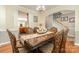 Elegant dining room with hardwood floors, chandelier, and spacious layout, perfect for gatherings at 10237 Broken Stone Ct, Charlotte, NC 28214