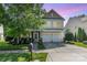 Charming two-story home featuring a two-car garage, landscaped yard and inviting front porch at 10237 Broken Stone Ct, Charlotte, NC 28214