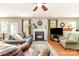 Inviting living room features a fireplace, hardwood flooring and lots of natural light at 10237 Broken Stone Ct, Charlotte, NC 28214